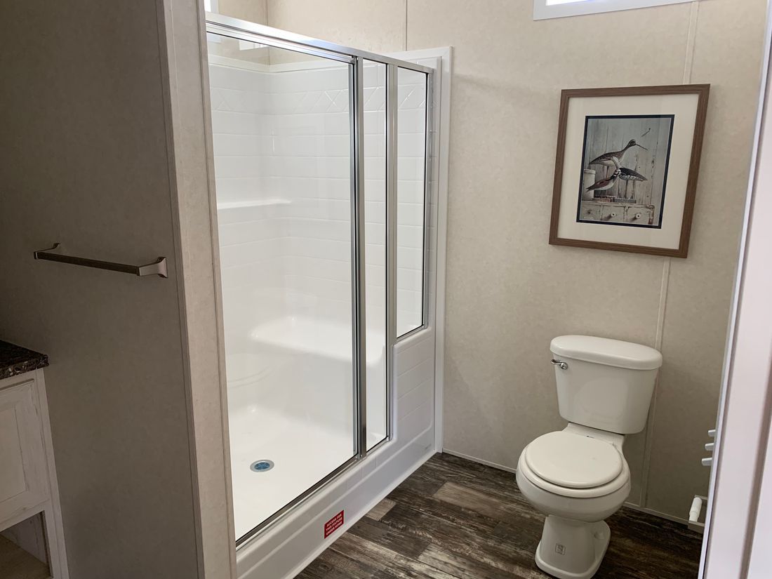 The LAWRENCE 7016-707 Guest Bathroom. This Manufactured Mobile Home features 3 bedrooms and 2 baths.