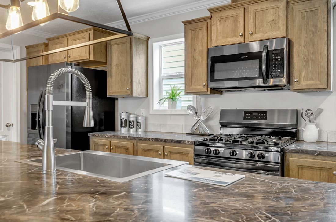 The MIFFLIN 6028-942 Kitchen. This Manufactured Mobile Home features 3 bedrooms and 2 baths.