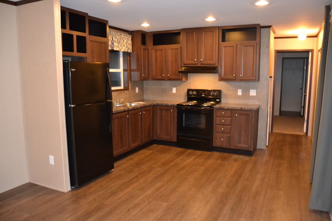 The ALLEGHENY 7014-660 Kitchen. This Manufactured Mobile Home features 3 bedrooms and 2 baths.