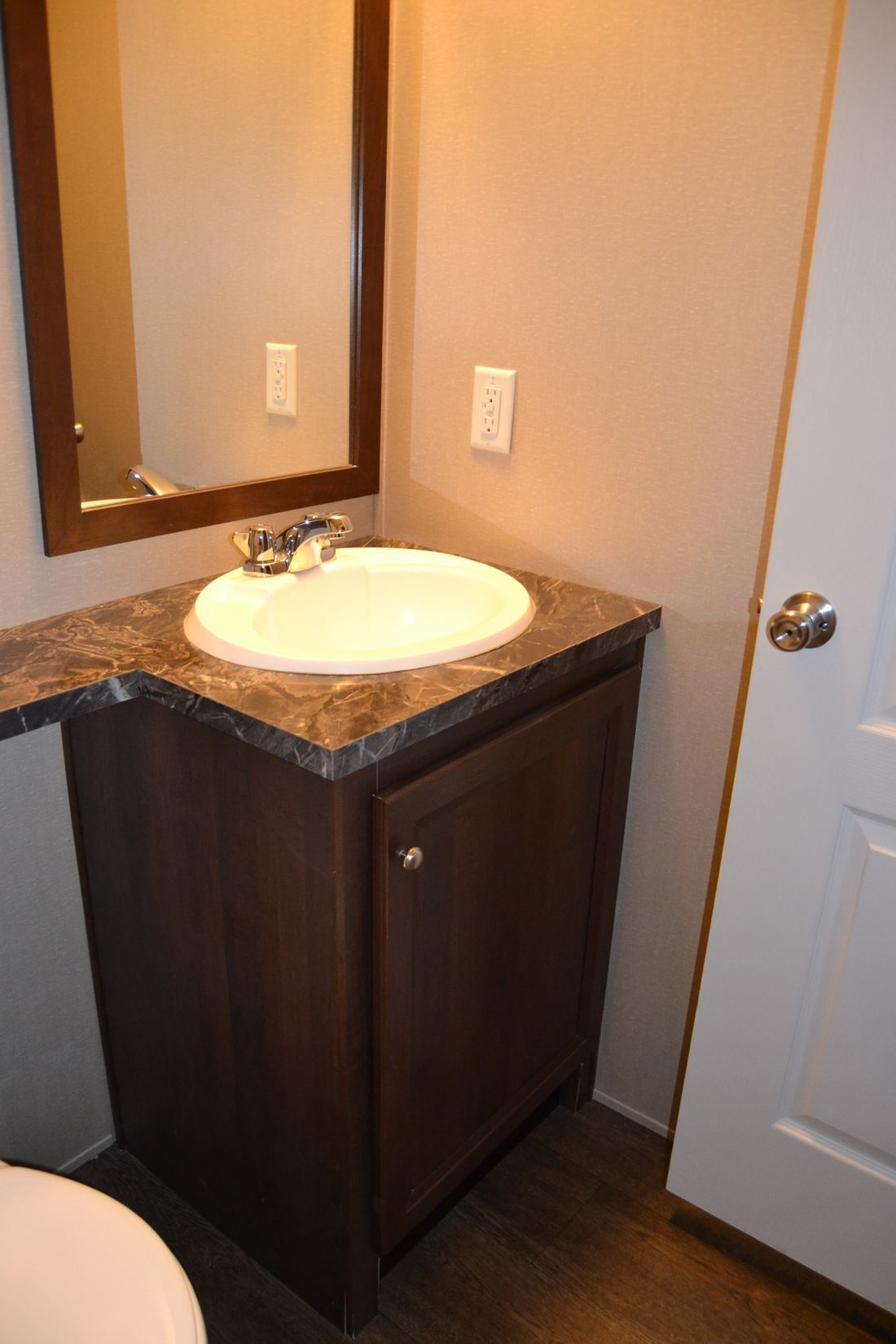 The ALLEGHENY 7014-660 Guest Bathroom. This Manufactured Mobile Home features 3 bedrooms and 2 baths.